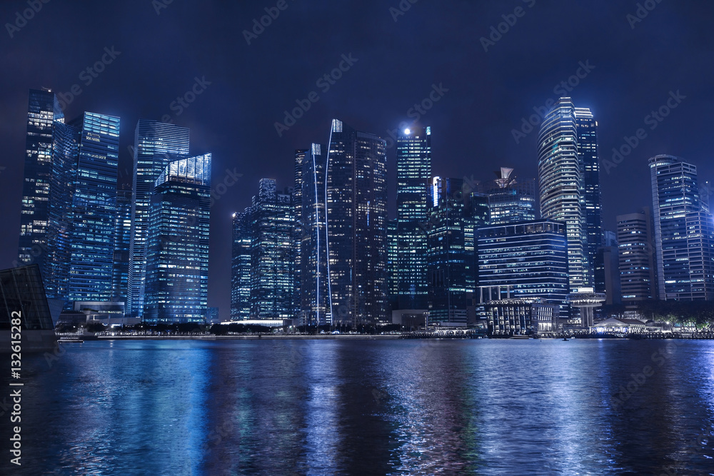 modern city skyline by night, business skyscrapers, office buildings with reflection in water modern city skyline by night, business skyscrapers, office buildings with reflection in water