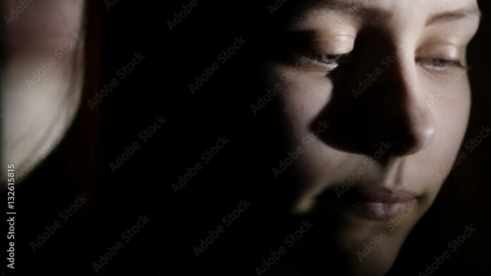 2Closeup portrait of a depressed teen girl in the dark. 4K UHD. 2Closeup portrait of a depressed teen girl in the dark. 4K UHD.