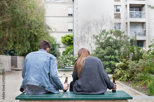 alcoholism, young people drinking beer on the bench