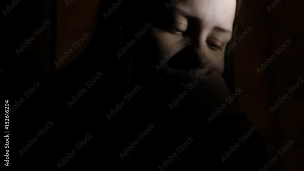 5Closeup portrait of a depressed teen girl in the dark. 4K UHD. 5Closeup portrait of a depressed teen girl in the dark. 4K UHD.