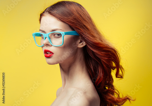 Wallpaper Mural woman in glasses on a yellow background, a woman with glasses, woman Torontodigital.ca