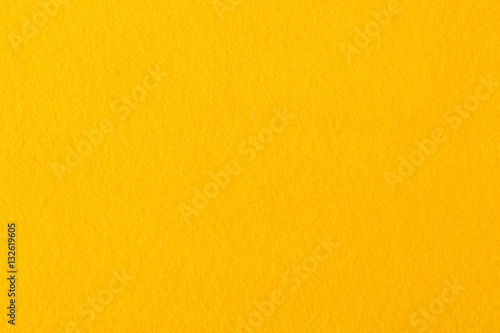 Close up of bright yellow felt fabric. photo