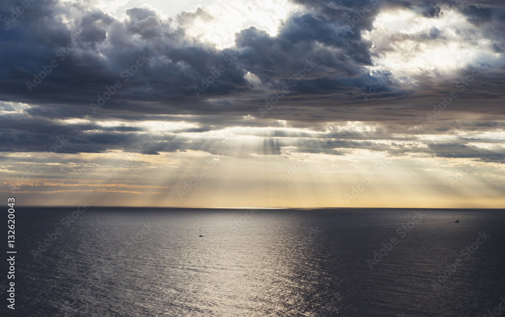 Clouds blue sky and sunlight sunset on horizon ocean . Сloudscape on background seascape dramatic atmosphere rays sunrise. Relax view waves sea with ship, mockup nature evening concept..