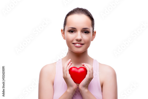 Young woman with red heart isolated on white
