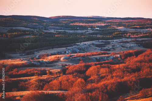 Aerial Sunset view of Mountains plateau area with forest natural sunset red colors Travel scenery