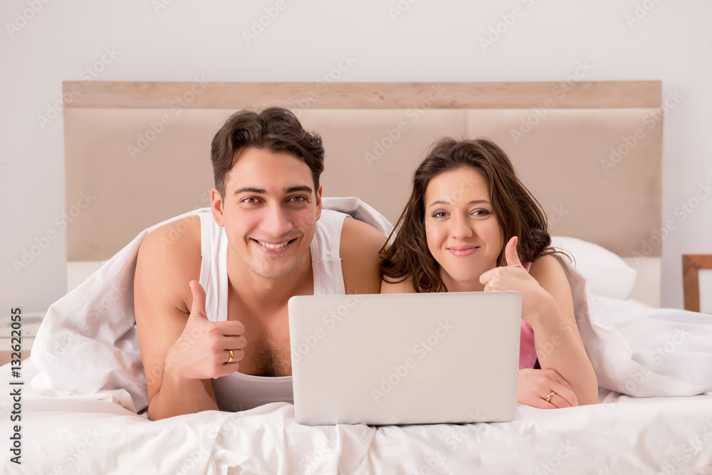 Funny concept with wife and husband in bed Funny concept with wife and husband in bed