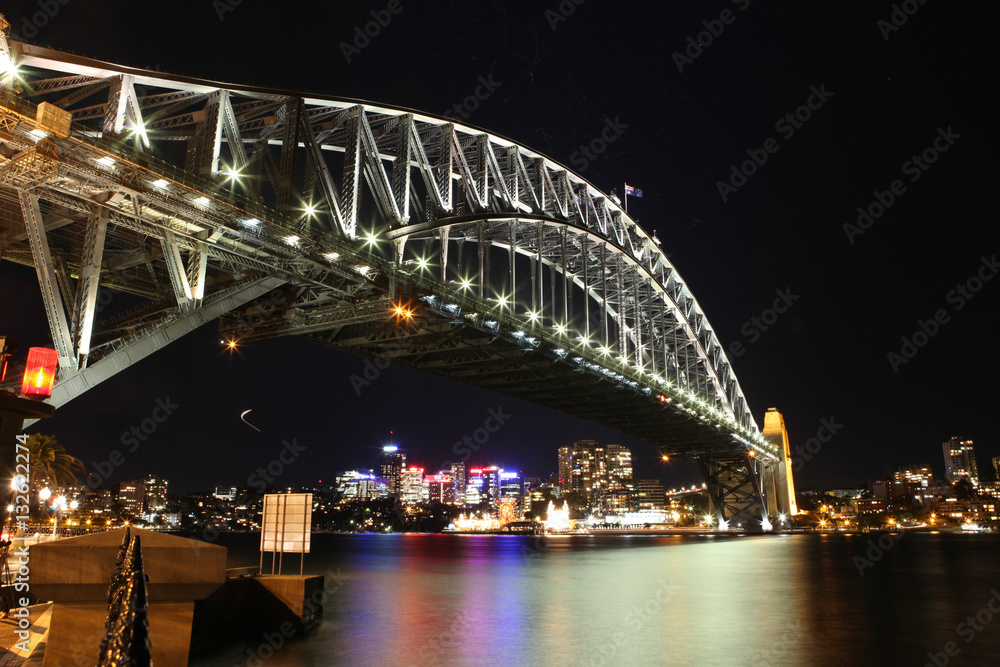 Obraz premium Sydney Harbour night time Panorama with bridge in North Sydney