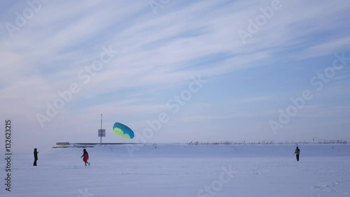 a young man kiteboarding launched parachute from the sky, 4k photo