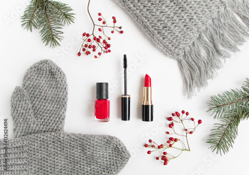 Winter accessories collage with cosmetics and clothes on white background. Flat lay, top view
