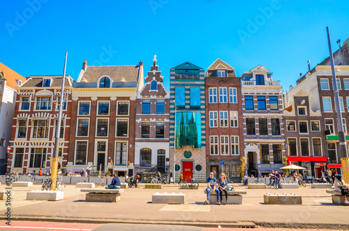 Photography Traditional old buildings and and boats in Amsterdam, Netherlands
