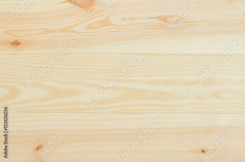 Fotografia Fresh knotted pine wood planks background top view