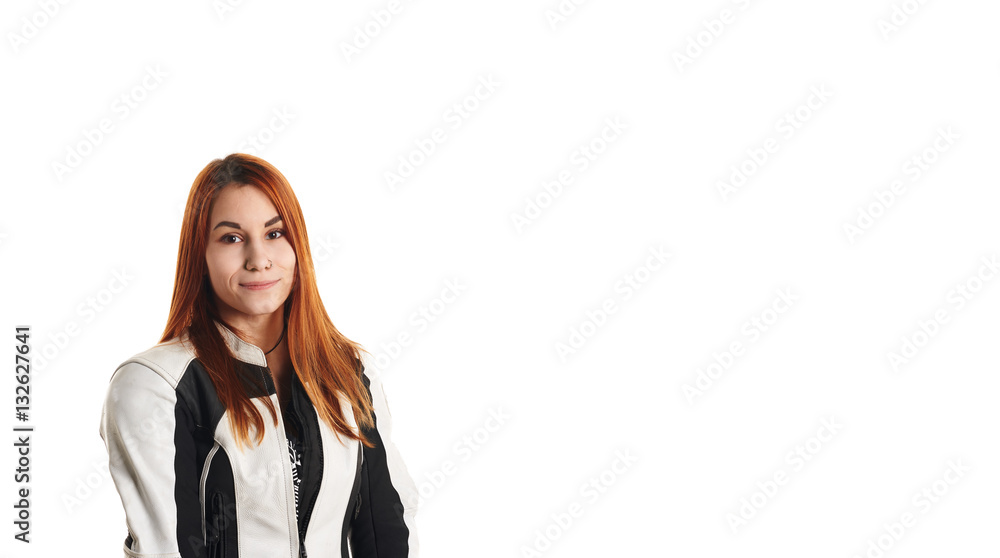 Handsome red head girl portrait in moto equipment on neutral white background. Femail biker shot. Copy space for advertising motorcycle Handsome red head girl portrait in moto equipment on neutral white background. Femail biker shot. Copy space for advertising motorcycle