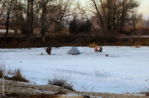 Winter fishing on a frozen river