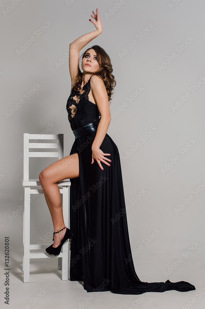 Individuality. Thoughtful Elegant Lady in Black Prom Evening Dress. Studio retouched photo. Individuality. Thoughtful Elegant Lady in Black Prom Evening Dress. Studio retouched photo.