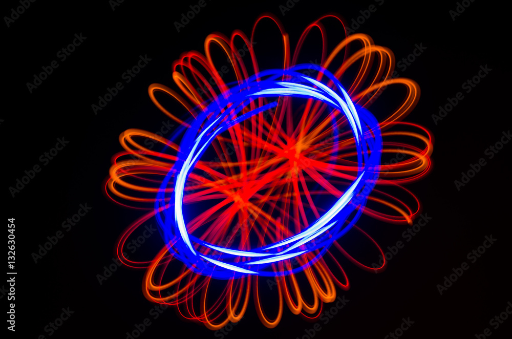 Light spiral, red and blue lines on a black background Light spiral, red and blue lines on a black background