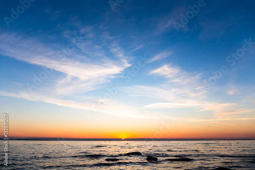 Bright sky and water at sunset