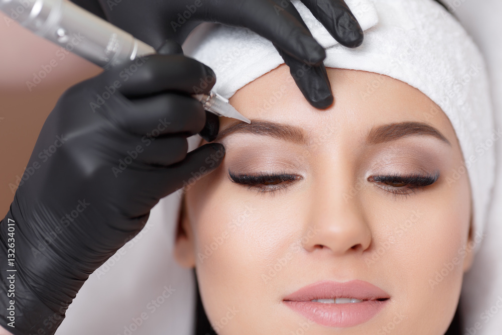 Permanent makeup. Tattooing of eyebrows - obrazy, fototapety, plakaty 