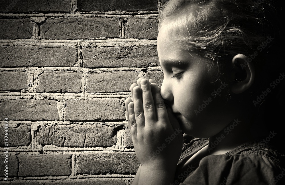 Praying child.