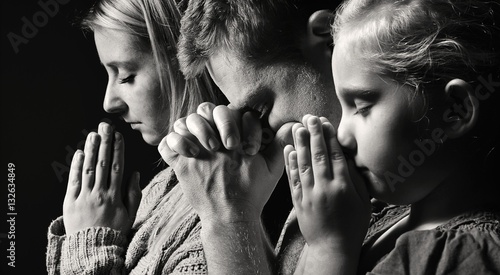 Fotografie, Obraz Praying family. Man, woman and child.