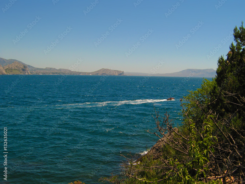 away at sea sailing boat a sunny summer day, resort in Greece