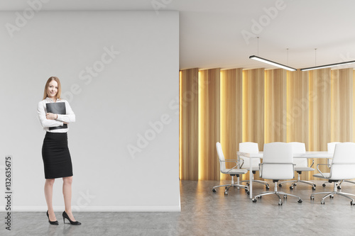 Blond woman in a boardroom