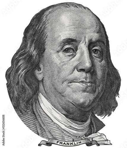 Benjamin Ben Franklin face on US 100 dollar bill closeup isolated, United States of America money close up. photo