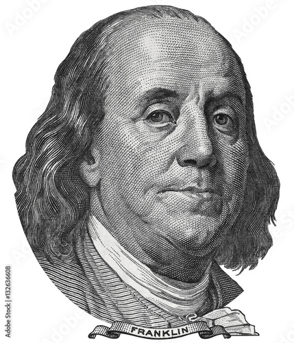 Benjamin Ben Franklin face on US 100 dollar bill closeup isolated, United States of America money close up.