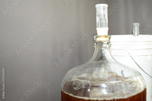 Photography Home brew glass carboy filled with beer