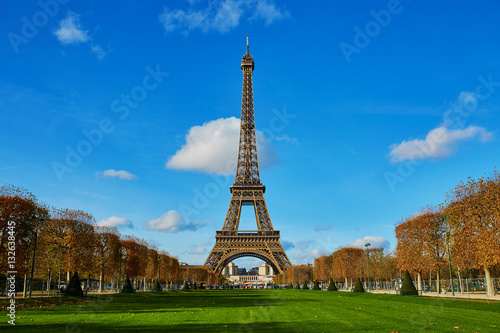 Eiffel tower over blue sky. Sunny autumn day in Paris