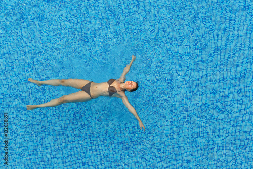 Woman relaxing in the pool