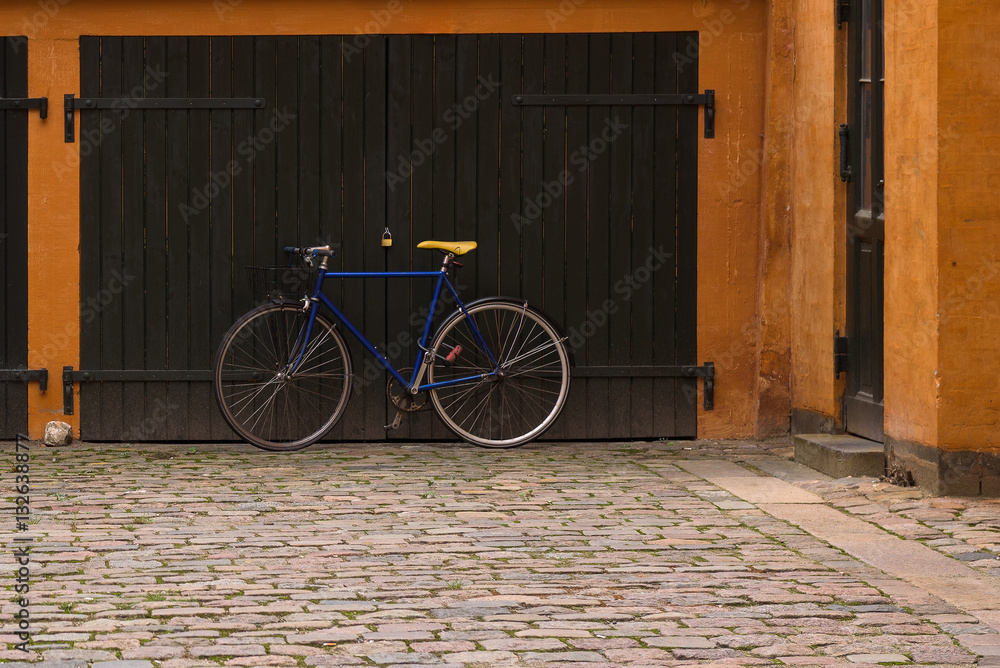 Racing bicycle parked in front of the garage, Copenhagen, Denmark Racing bicycle parked in front of the garage, Copenhagen, Denmark