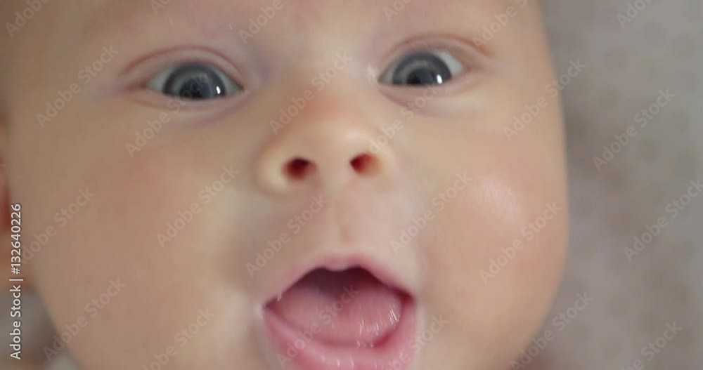 Adorable baby is joyful and feels impatient. Extremely close up. Adorable baby is joyful and feels impatient. Extremely close up.