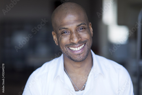 Portrait Of A Mature Black Man Smiling At The Camera.Home