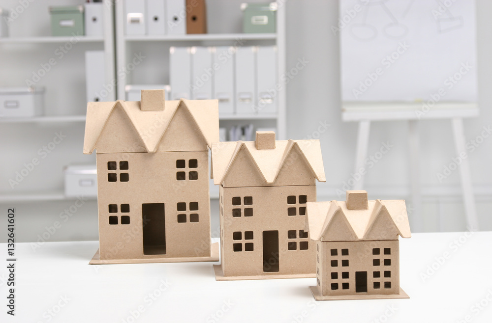 Miniature houses on the desk in office