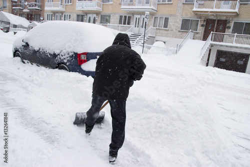 Shovelling Snow in a Winter Snow Storm in Montreal Quebec Canada North