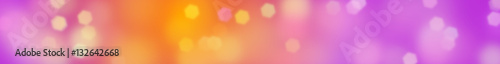 hexagon bokeh effect banner background in shades of soft white, pink, purple, orange and yellow