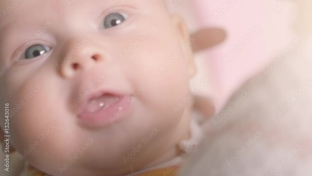 Mother kissed gently baby's face close up. Happy childhood concept. Mother kissed gently baby's face close up. Happy childhood concept.