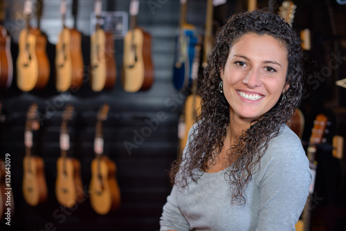 Portrait of woman in guitar shop