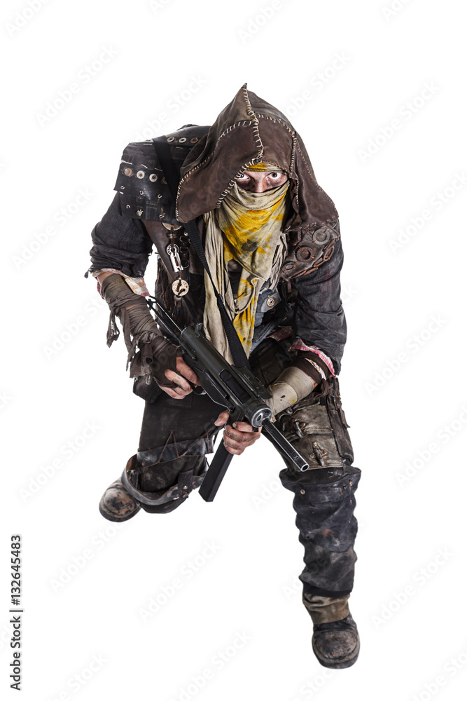 Fototapeta premium Nuclear post apocalypse life after doomsday concept. Grimy survivor with homemade weapons. Studio high angle portrait on white background