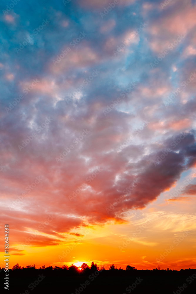 Fototapeta premium Sunset, Sunrise Over Rural Field Meadow. Bright Dramatic Sky And
