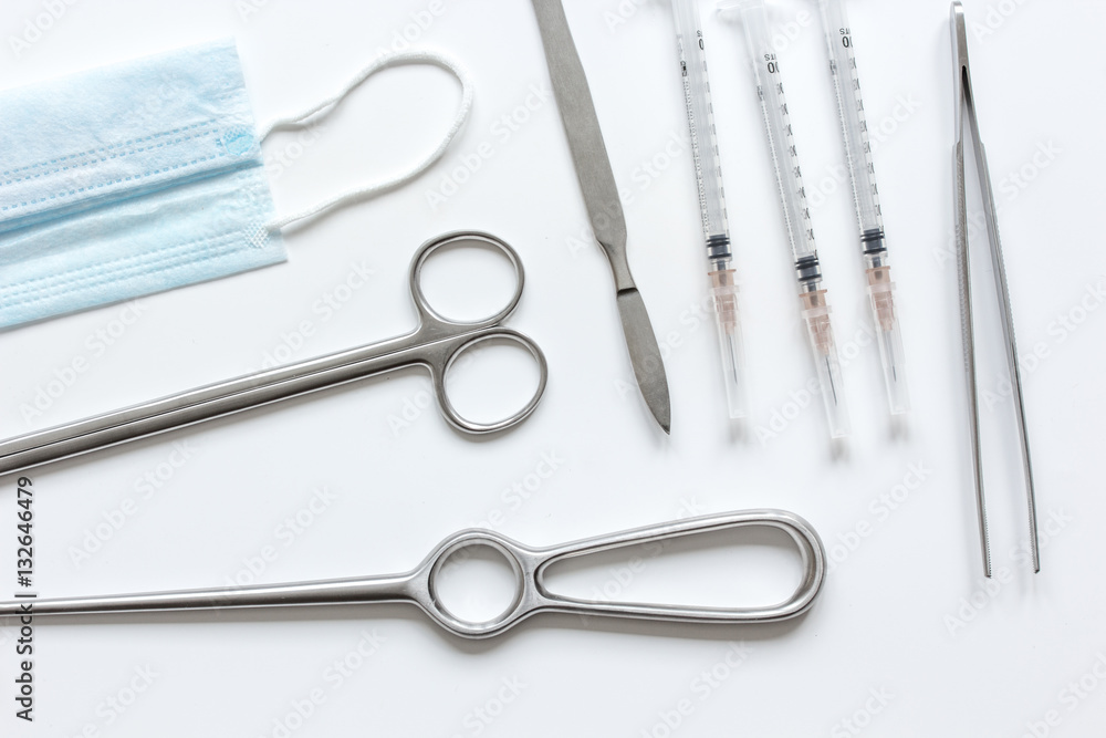 instruments for cosmetic surgery on white background top view instruments for cosmetic surgery on white background top view