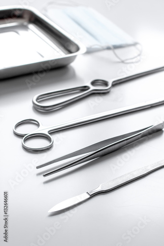 instruments for plastic surgery on white background