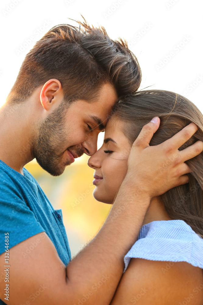 Fototapeta premium Beautiful young couple sensual hugging closeup