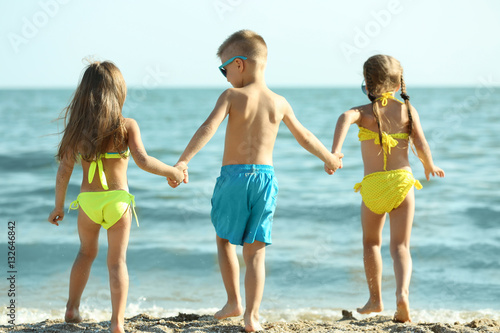 Cute kids having fun on beach