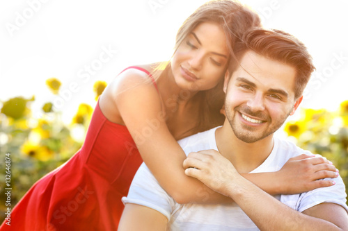 Beautiful young couple sitt...