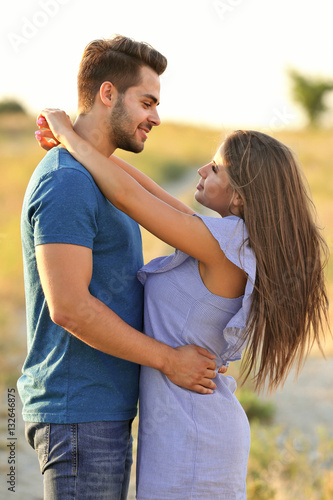Beautiful young couple stan...