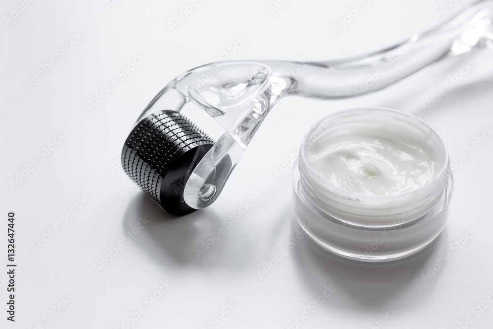 concept beautician desktop with mezoroller - mesotherapy on white background concept beautician desktop with mezoroller - mesotherapy on white background