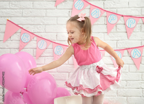 Little cute girl with party...