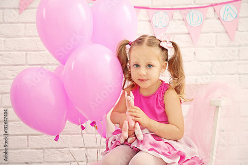 Little cute girl with party...
