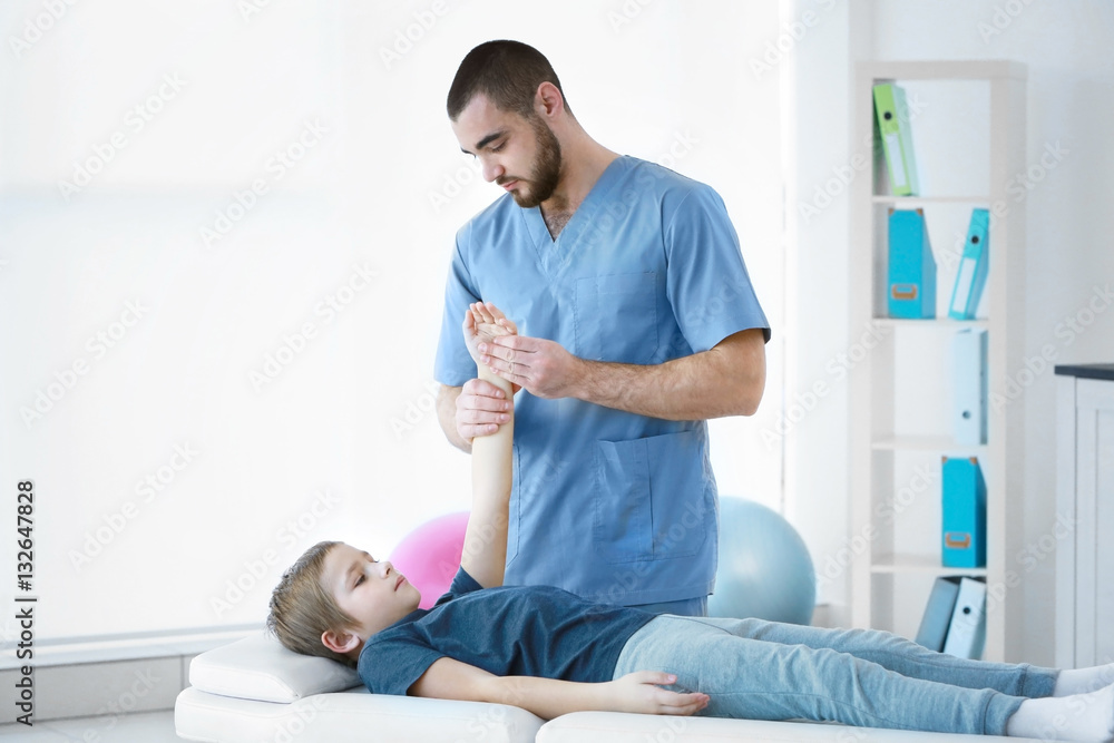 Physiotherapist working with patient in clinic Physiotherapist working with patient in clinic